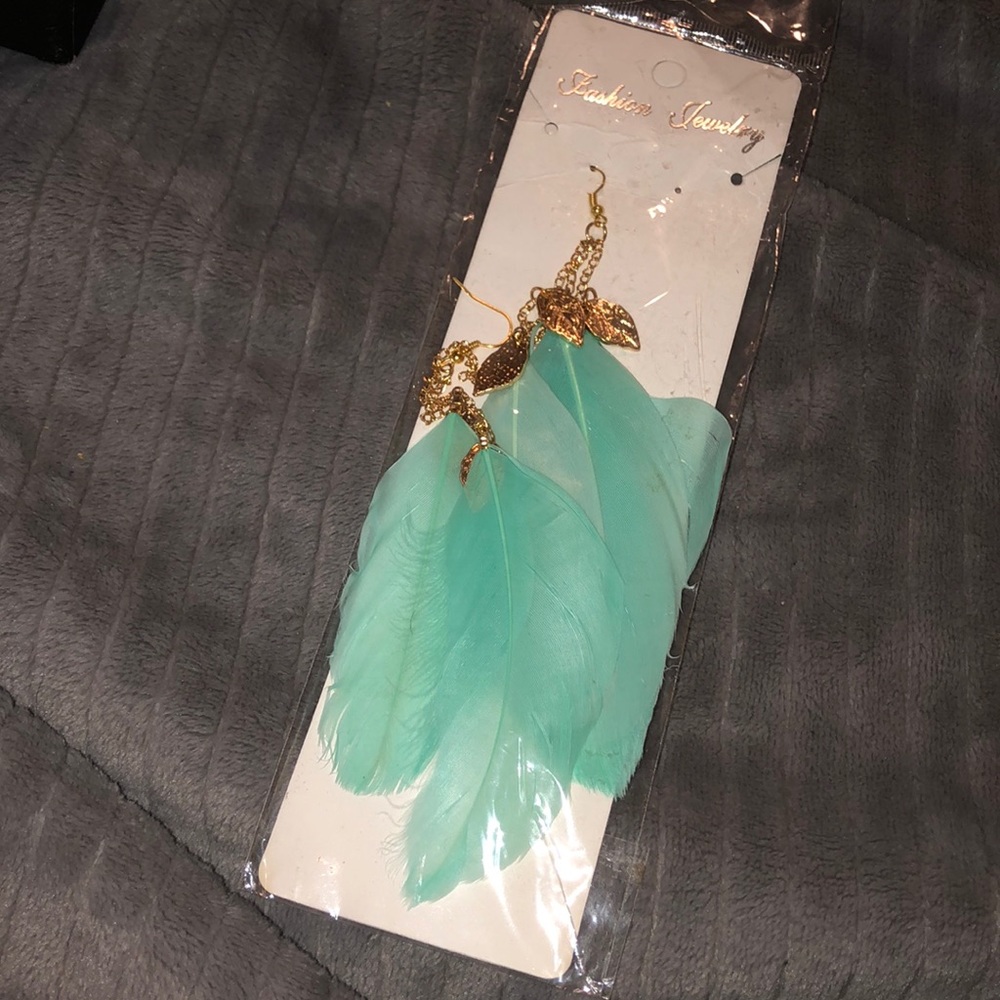 Brand new teal feather earrings